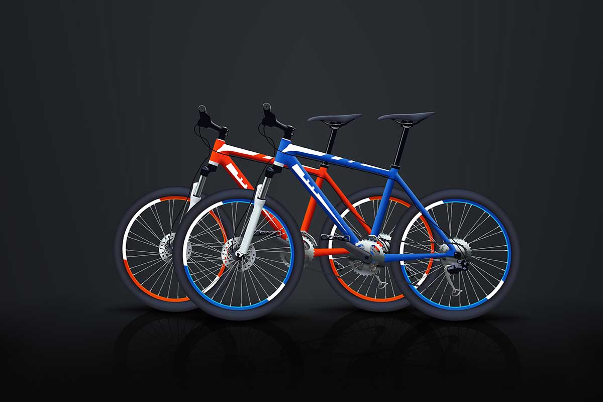 Quelle est la différence entre un vélo de course et un vélo de route ? illustration deux vélos de courses bleu et rouge
